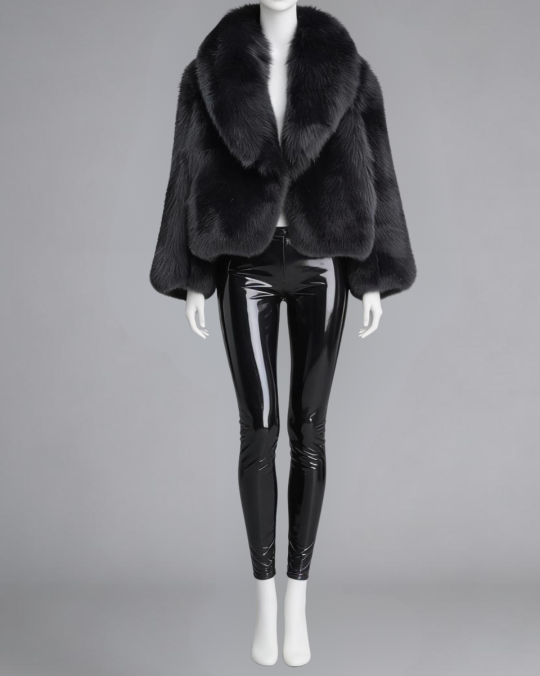 Front view of a waist-length authentic black fox fur coat with a large shawl collar on a mannequin.